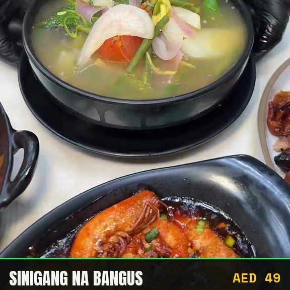 Filipino sinigang sour soup cooked at Pinoy Tambayan in Dubai